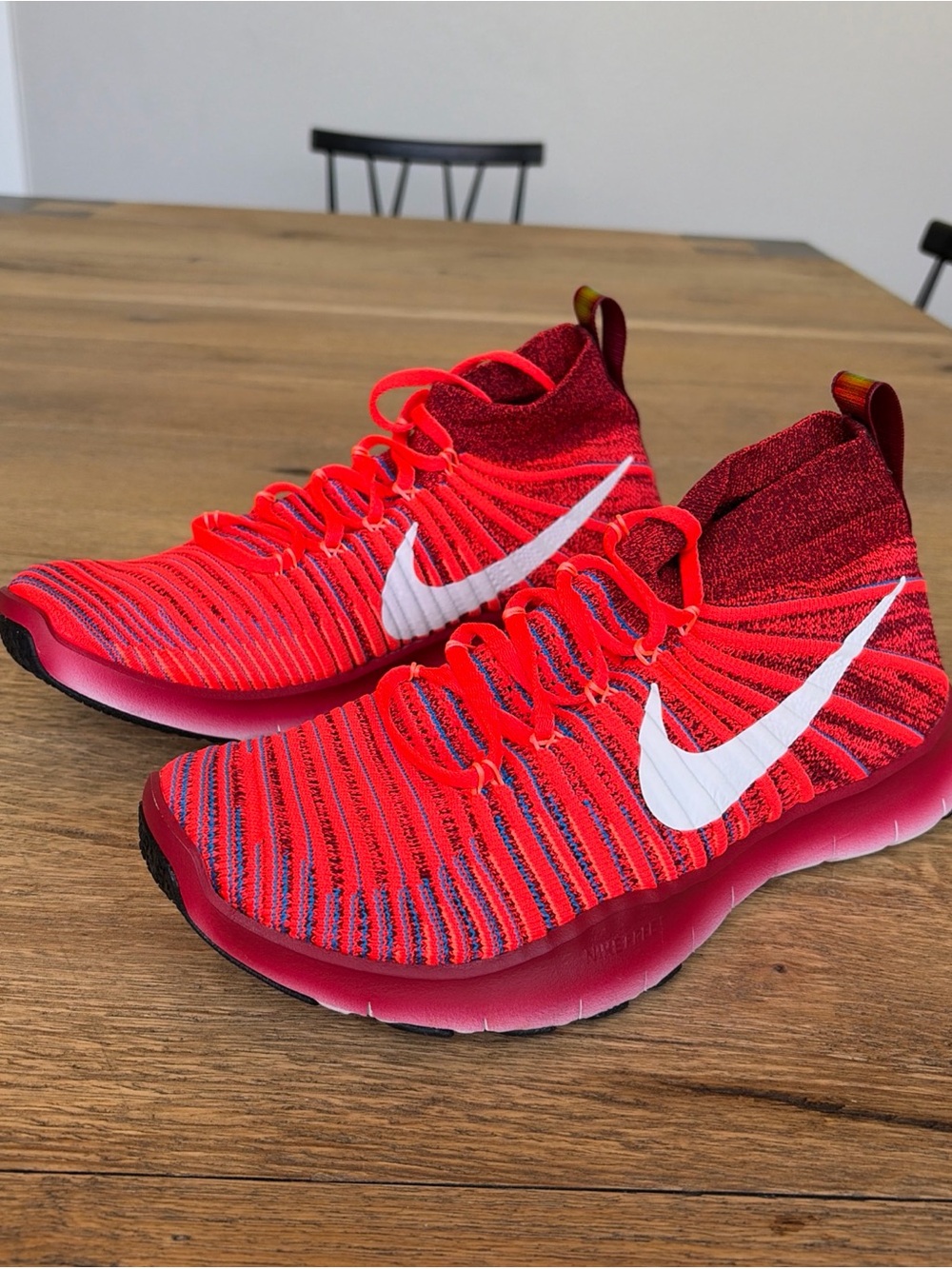 Nike Vibrant Red Flyknit High-Top Sneakers with White Swoosh